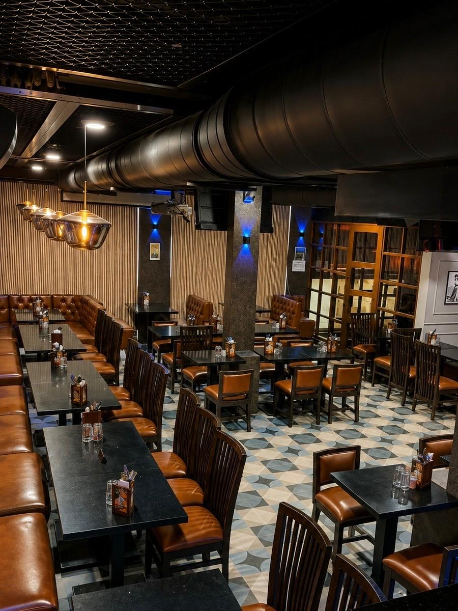 Wide angle perspective of the entire lounge and bar counter floor at Big Bull Cafe Chakala